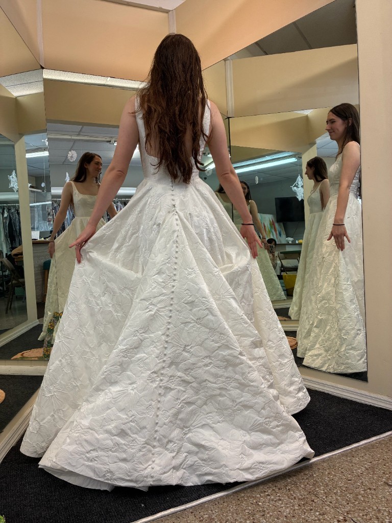 Bridal fitting — wedding gown altered to fit right for the big day